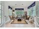 Charming sun room with wicker furniture and abundant light at 2630 Filson Ct, Charlotte, NC 28214