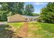 Expansive backyard view featuring a well-maintained lawn and a cozy patio, perfect for outdoor entertaining at 267 Winthrow Creek Rd, Mooresville, NC 28115