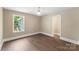Inviting bedroom with large window, neutral walls, and wood-look flooring for comfortable living at 267 Winthrow Creek Rd, Mooresville, NC 28115