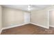 This room features hardwood floors, a ceiling fan, and ample closet space at 267 Winthrow Creek Rd, Mooresville, NC 28115