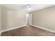 Cozy bedroom with ceiling fan, neutral walls, and wood-look flooring for comfortable living at 267 Winthrow Creek Rd, Mooresville, NC 28115
