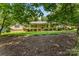Traditional one-story home with mature trees and landscaping in a serene setting at 267 Winthrow Creek Rd, Mooresville, NC 28115