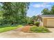 A well-manicured front yard featuring a cozy porch, and lush landscaping at 267 Winthrow Creek Rd, Mooresville, NC 28115