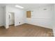 Bright living room area with hardwood floors, neutral walls, and easy access to other rooms at 267 Winthrow Creek Rd, Mooresville, NC 28115