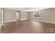 Large, bright main bedroom with hardwood floors and neutral walls at 267 Winthrow Creek Rd, Mooresville, NC 28115