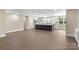 Open concept floor plan connecting the living area to the kitchen with a large center island at 267 Winthrow Creek Rd, Mooresville, NC 28115