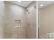 Modern shower showcasing stylish tile, glass enclosure, and rainfall showerhead for a spa-like experience at 267 Winthrow Creek Rd, Mooresville, NC 28115