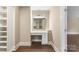 Bright walk-in closet features custom vanity and shelves for optimal organization and modern elegance at 267 Winthrow Creek Rd, Mooresville, NC 28115