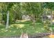 Scenic lakefront property with a sprawling lawn, private dock, and picturesque natural beauty at 2704 Apache Trl, Denver, NC 28037