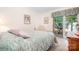 Cozy bedroom featuring access to an outdoor balcony with scenic views, creating a tranquil retreat at 2704 Apache Trl, Denver, NC 28037