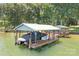Boat dock with a covered boat slip provides convenient lake access and boat storage at 2704 Apache Trl, Denver, NC 28037