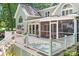 Beautiful home featuring an outdoor deck with grill, hot tub, and screened-in porch for relaxing lake views at 2704 Apache Trl, Denver, NC 28037