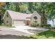 Inviting home with a two-car garage, beautiful landscaping, and a spacious driveway perfect for outdoor living at 2704 Apache Trl, Denver, NC 28037