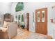 Elegant foyer with a grand window, hardwood floors, and classic furnishings, creating a welcoming entrance at 2704 Apache Trl, Denver, NC 28037
