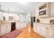 Bright kitchen featuring white cabinets, granite countertops, and stainless steel appliances, perfect for cooking and entertaining at 2704 Apache Trl, Denver, NC 28037