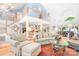 Open-concept living room with high ceilings and a view to the kitchen, perfect for modern living and entertaining at 2704 Apache Trl, Denver, NC 28037