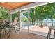 Relaxing screened-in porch with a hot tub on the deck, offering a serene outdoor living experience at 2704 Apache Trl, Denver, NC 28037