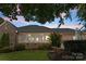 Backyard with screened in porch, brick and vinyl siding, and lawn at 2818 Levinfield Ct, Lincolnton, NC 28092