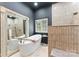 Beautiful bathroom features a soaking tub with a large decorative mirror and tiled walk-in shower at 2818 Levinfield Ct, Lincolnton, NC 28092