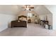Attic bedroom with a patterned bed, charming decor, and sloped ceilings at 2818 Levinfield Ct, Lincolnton, NC 28092
