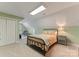 Comfortable bedroom featuring a skylight, plush carpet, sitting area, and muted green walls at 2818 Levinfield Ct, Lincolnton, NC 28092
