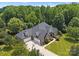 Beautiful brick home with a three-car garage and expansive driveway and mature landscaping at 2818 Levinfield Ct, Lincolnton, NC 28092
