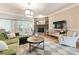 Comfortable living room featuring a stone fireplace, plush seating, and a large television at 2818 Levinfield Ct, Lincolnton, NC 28092