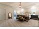 Cozy main bedroom with a sitting area, neutral carpet, and access to an en-suite bathroom at 2818 Levinfield Ct, Lincolnton, NC 28092