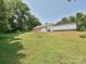 Expansive backyard featuring a wooden deck and lush green lawn, perfect for outdoor entertaining and relaxation at 285 Hannah Ave, Salisbury, NC 28147