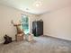 Bedroom boasts a large window and neutral carpet, plus closet space at 285 Hannah Ave, Salisbury, NC 28147