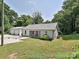 Charming home with a detached garage and well-manicured lawn, showcasing a welcoming front exterior and curb appeal at 285 Hannah Ave, Salisbury, NC 28147