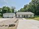 Charming single-story home with a detached garage and well-maintained front yard at 285 Hannah Ave, Salisbury, NC 28147