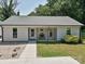 Inviting single-story home with a covered porch and neatly landscaped front yard at 285 Hannah Ave, Salisbury, NC 28147