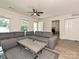 Bright living room features a large gray couch, modern ceiling fan, and plenty of natural light at 285 Hannah Ave, Salisbury, NC 28147