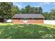 Lush backyard with a well-maintained lawn, perfect for outdoor activities and relaxation at 2916 Northwood Dr, Monroe, NC 28110