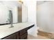 Bathroom vanity featuring ample counter space, a mirror, and neutral-toned tile flooring at 2916 Northwood Dr, Monroe, NC 28110