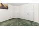Cozy bedroom features neutral walls, carpet, and closet for ample storage space at 2916 Northwood Dr, Monroe, NC 28110