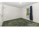 Comfortable bedroom with ample natural light from the window and convenient closet space at 2916 Northwood Dr, Monroe, NC 28110