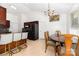 Open kitchen with bar seating, a dining area, and modern appliances at 2916 Northwood Dr, Monroe, NC 28110