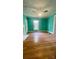 Spacious bedroom featuring hardwood floors, a ceiling fan and window at 300 Gurley St, Kannapolis, NC 28081