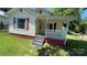 A charming home with a cozy porch and red accents at 300 Gurley St, Kannapolis, NC 28081
