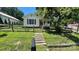 Charming home with a well-manicured front yard, fence, and inviting walkway at 300 Gurley St, Kannapolis, NC 28081