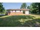Backyard view of home with a combination brick and siding exterior at 326 Gorrell St, Shelby, NC 28152