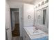 Bathroom with white vanity, mirror, and built-in storage cabinets at 326 Gorrell St, Shelby, NC 28152