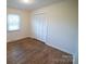 Bright bedroom features hardwood floors, closet, and natural light from a window at 326 Gorrell St, Shelby, NC 28152