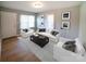 Bright living room features two chairs, couch, coffee table, hardwood floors and two windows at 326 Gorrell St, Shelby, NC 28152