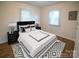 Beautifully staged bedroom with a stylish bed, nightstands, lamps, and an area rug at 326 Gorrell St, Shelby, NC 28152