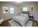 Professionally staged bedroom with modern decor, a comfortable bed, and an area rug at 326 Gorrell St, Shelby, NC 28152