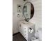 The bathroom features shiplap walls, oval mirror, modern vanity with matte black hardware and a shelf at 328 Glenridge Ct, Indian Trail, NC 28079
