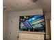This bedroom features a dresser with a large television with an image of a historic building at 328 Glenridge Ct, Indian Trail, NC 28079